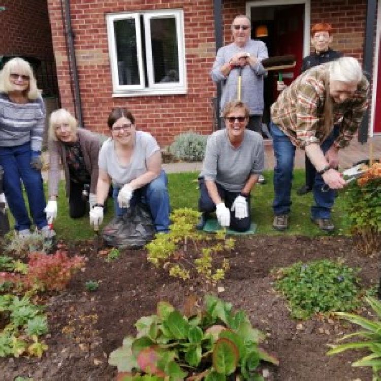 Customers working together on a Wellbeing Fund Project